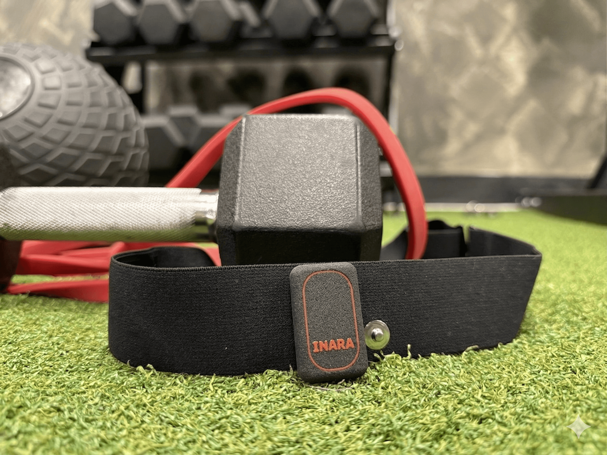 Inara sensor beside fitness equipment and wearables.