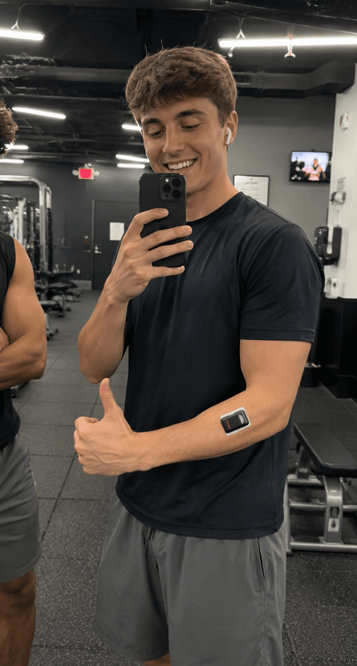 Athlete wearing an Inara sensor on their arm in the gym